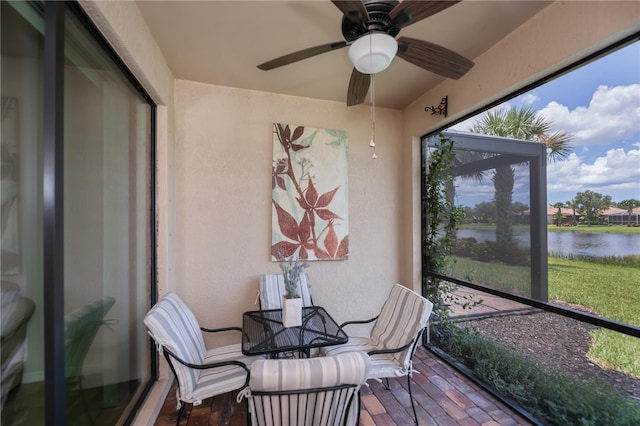 19269 Serafina St, Venice, FL 34293 - sunroom with a water view and a ceiling fan