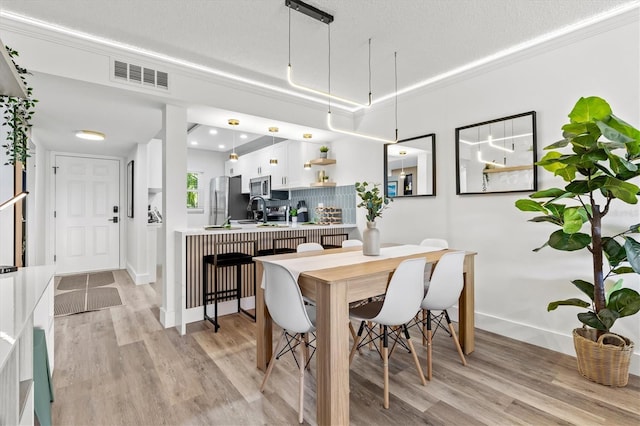 437 Cerromar Ln Unit 424, Venice, FL 34293 - dining space featuring light wood-style floors