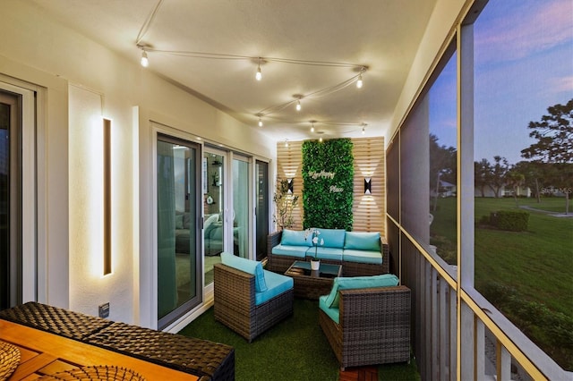 437 Cerromar Ln Unit 424, Venice, FL 34293 - sunroom featuring rail lighting and an outdoor living space