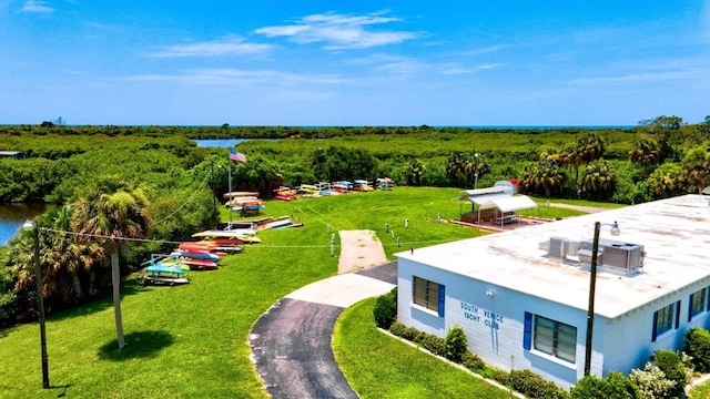 437 Cerromar Ln Unit 424, Venice, FL 34293 - drone / aerial view of a heavily wooded area and a large body of water
