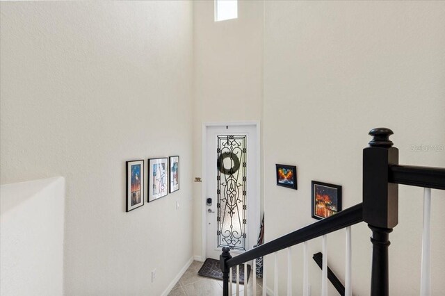 935 Tidewater Shrs Unit 721, Bradenton, FL 34208 - hallway featuring a high ceiling and baseboards