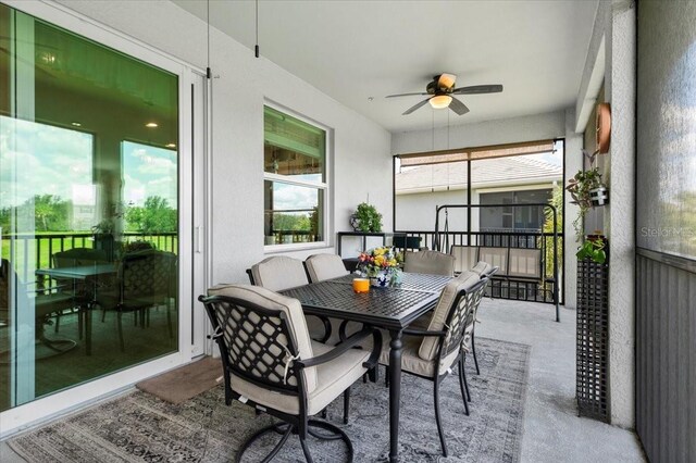 935 Tidewater Shrs Unit 721, Bradenton, FL 34208 - sunroom with a ceiling fan and outdoor dining space