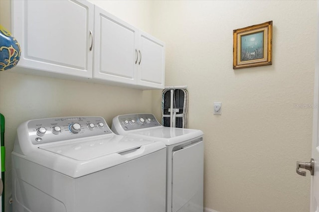 935 Tidewater Shrs Unit 721, Bradenton, FL 34208 - laundry area featuring separate washer and dryer and cabinet space