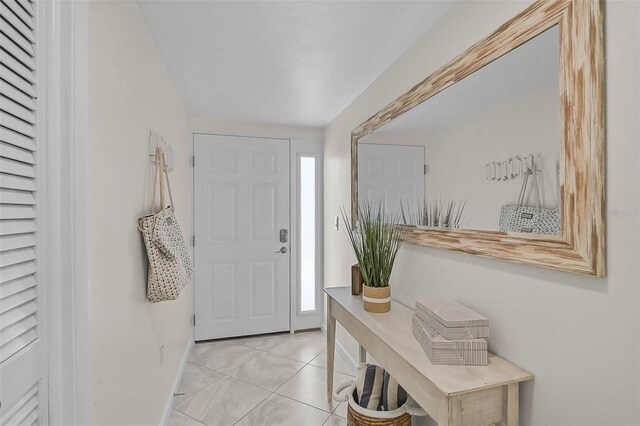950 Tarpon Center Dr Unit 305, Venice, FL 34285 - entryway featuring light tile patterned floors and baseboards