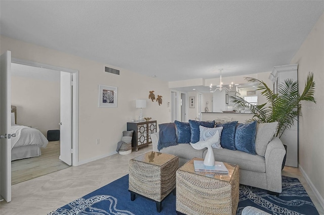 950 Tarpon Center Dr Unit 305, Venice, FL 34285 - living area with a chandelier and a textured ceiling