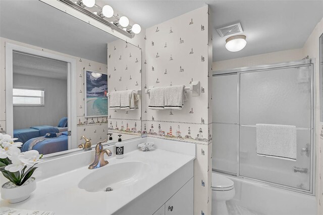 950 Tarpon Center Dr Unit 305, Venice, FL 34285 - full bath with vanity, ensuite bathroom, and bath / shower combo with glass door