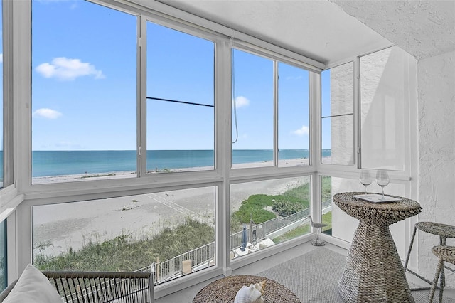 950 Tarpon Center Dr Unit 305, Venice, FL 34285 - sunroom featuring a water view and a textured wall