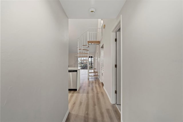 6800 Placida Rd Unit 280, Englewood, FL 34224 - hallway with light wood finished floors and baseboards