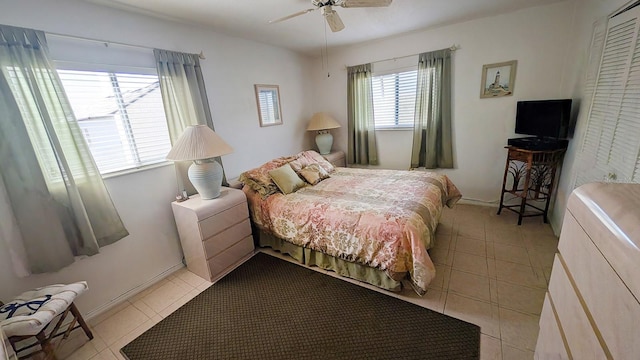 320 Base Ave E Unit 215, Venice, FL 34285 - bedroom with light tile patterned flooring and a ceiling fan