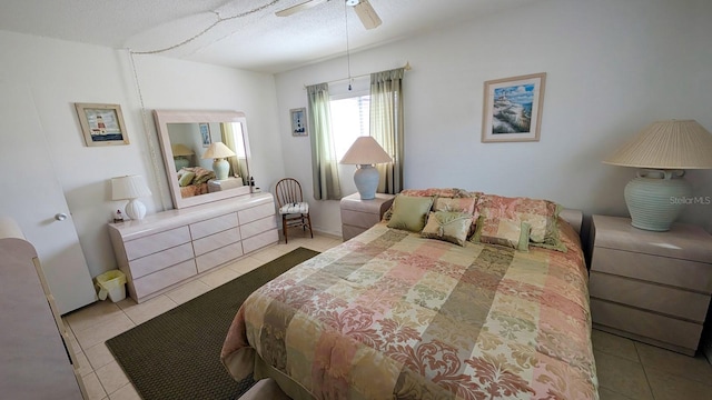 320 Base Ave E Unit 215, Venice, FL 34285 - tiled bedroom with a ceiling fan and a textured ceiling