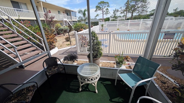 320 Base Ave E Unit 215, Venice, FL 34285 - view of patio / terrace featuring stairs and a community pool