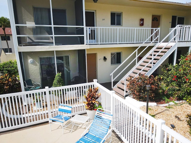 320 Base Ave E Unit 215, Venice, FL 34285 - porch featuring stairs