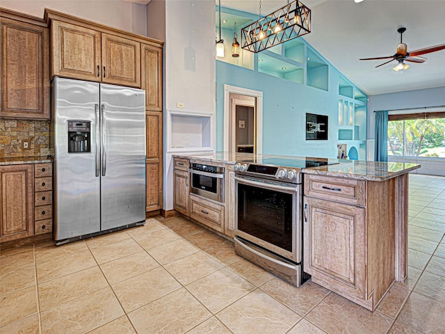 23102 Madelyn Ave, Port Charlotte, FL 33954 - kitchen featuring stainless steel appliances, open floor plan, a ceiling fan, a peninsula, and light stone countertops