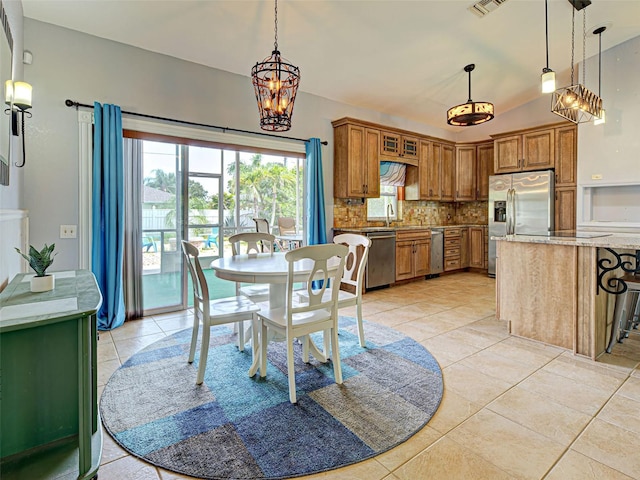 23102 Madelyn Ave, Port Charlotte, FL 33954 - dining area featuring light tile patterned flooring and a chandelier