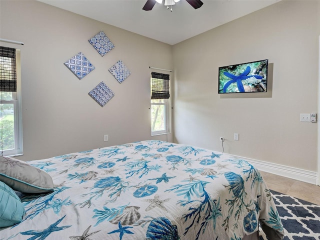 23102 Madelyn Ave, Port Charlotte, FL 33954 - tiled bedroom with multiple windows and ceiling fan