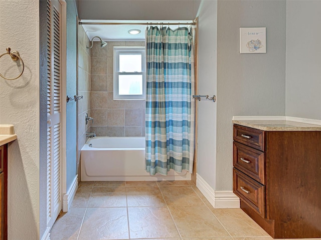 23102 Madelyn Ave, Port Charlotte, FL 33954 - full bath with vanity, shower / bath combination with curtain, a closet, a textured wall, and tile patterned floors