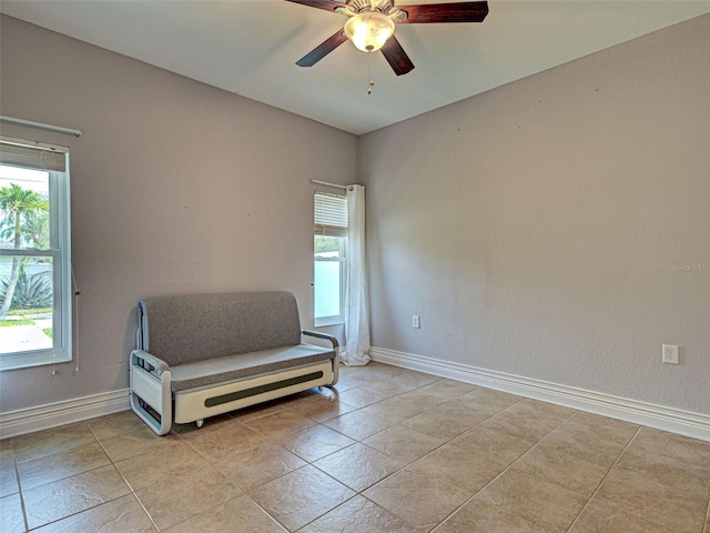 23102 Madelyn Ave, Port Charlotte, FL 33954 - living area with a ceiling fan and light tile patterned floors