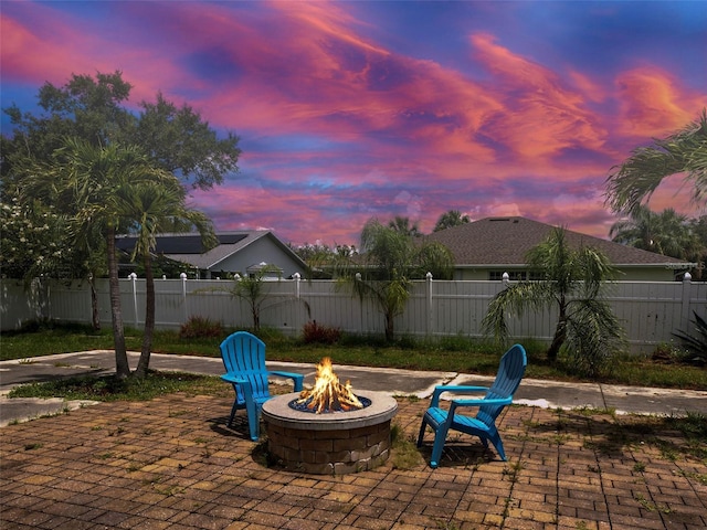 23102 Madelyn Ave, Port Charlotte, FL 33954 - fenced backyard featuring an outdoor fire pit and a patio