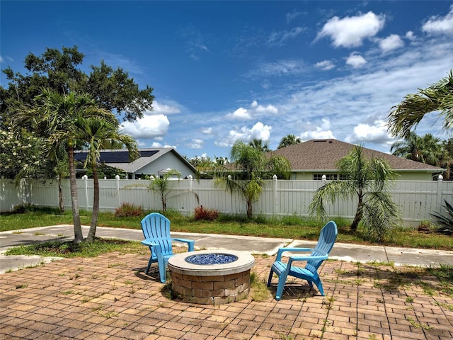 23102 Madelyn Ave, Port Charlotte, FL 33954 - fenced backyard featuring an outdoor fire pit and a patio