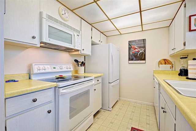 244 Saint Augustine Ave Unit 202, Venice, FL 34285 - kitchen with white appliances and light countertops