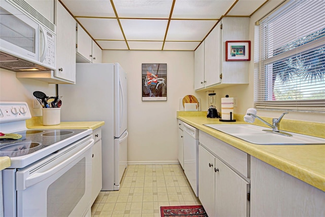 244 Saint Augustine Ave Unit 202, Venice, FL 34285 - kitchen featuring white appliances, light countertops, and white cabinets