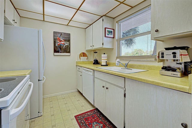 244 Saint Augustine Ave Unit 202, Venice, FL 34285 - kitchen featuring white appliances, light countertops, and white cabinetry