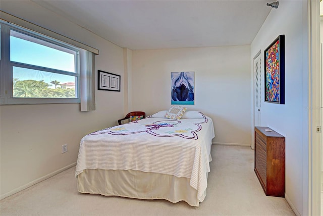244 Saint Augustine Ave Unit 202, Venice, FL 34285 - bedroom with light colored carpet