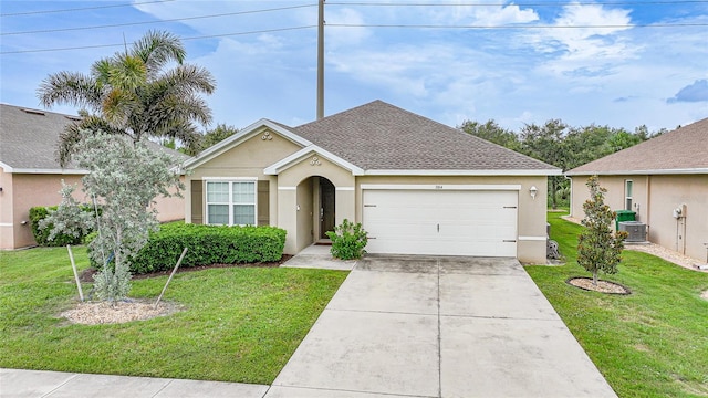 7164 Mikasa Dr, Punta Gorda, FL 33950 - view of front of house with an attached garage, stucco siding, a front lawn, and concrete driveway