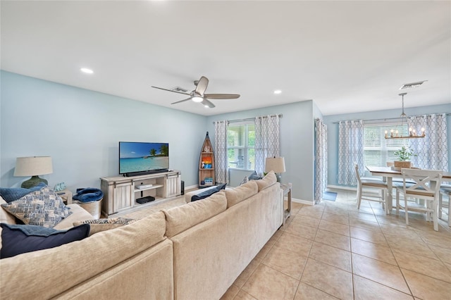 7164 Mikasa Dr, Punta Gorda, FL 33950 - living room featuring a chandelier, ceiling fan, light tile patterned floors, and recessed lighting