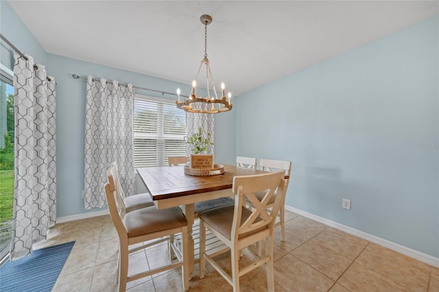 7164 Mikasa Dr, Punta Gorda, FL 33950 - dining room featuring a chandelier and light tile patterned flooring