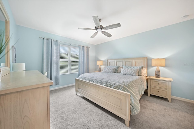 7164 Mikasa Dr, Punta Gorda, FL 33950 - bedroom with light colored carpet and a ceiling fan