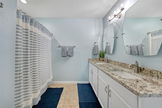 7164 Mikasa Dr, Punta Gorda, FL 33950 - full bath with double vanity, tile patterned floors, and curtained shower