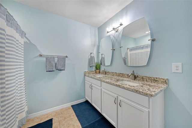 7164 Mikasa Dr, Punta Gorda, FL 33950 - bathroom featuring double vanity, tile patterned floors, and a shower with curtain