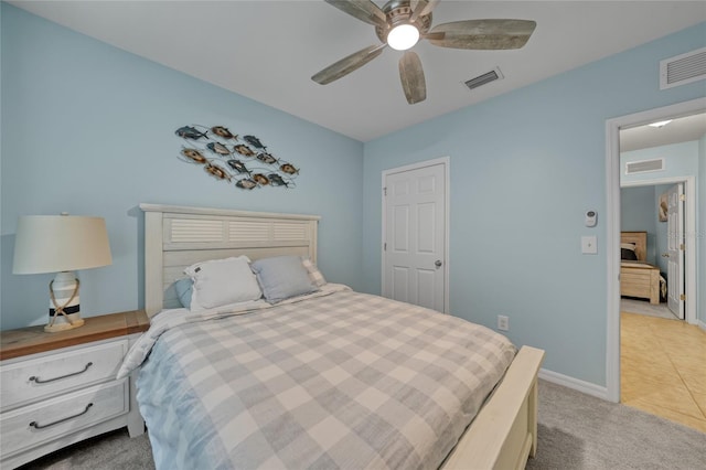 7164 Mikasa Dr, Punta Gorda, FL 33950 - bedroom featuring light colored carpet, ceiling fan, and light tile patterned floors