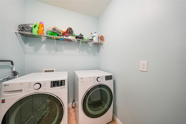 7164 Mikasa Dr, Punta Gorda, FL 33950 - laundry room with washing machine and dryer and tile patterned flooring