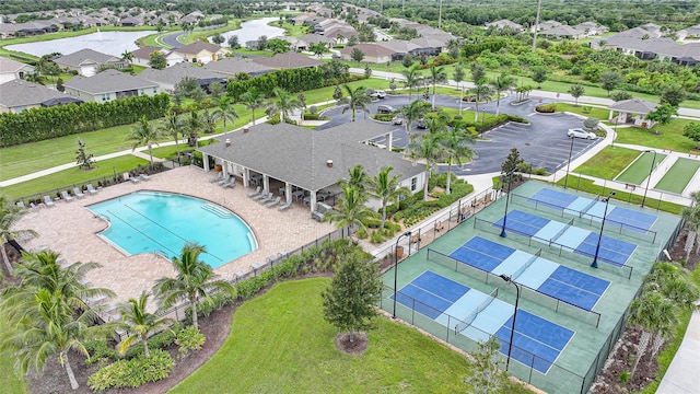 7164 Mikasa Dr, Punta Gorda, FL 33950 - aerial perspective of suburban area featuring a pool area and a nearby body of water