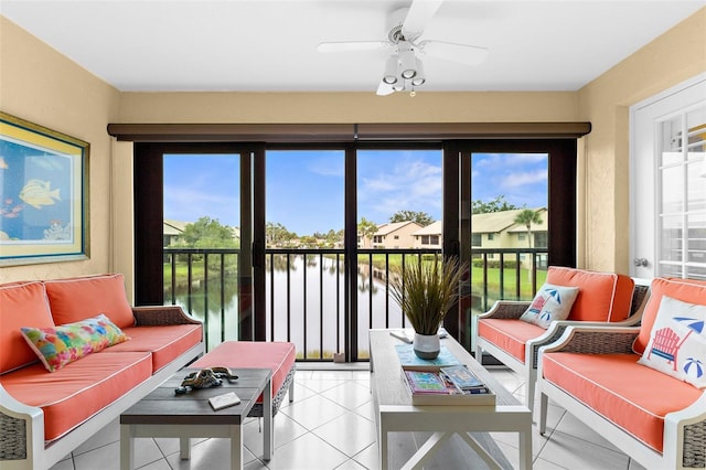 340 Three Lakes Ln Unit F, Venice, FL 34285 - living room with a ceiling fan, a water view, and light tile patterned flooring