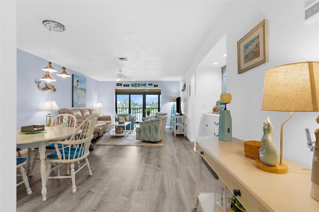 340 Three Lakes Ln Unit F, Venice, FL 34285 - dining room featuring ceiling fan and wood finished floors