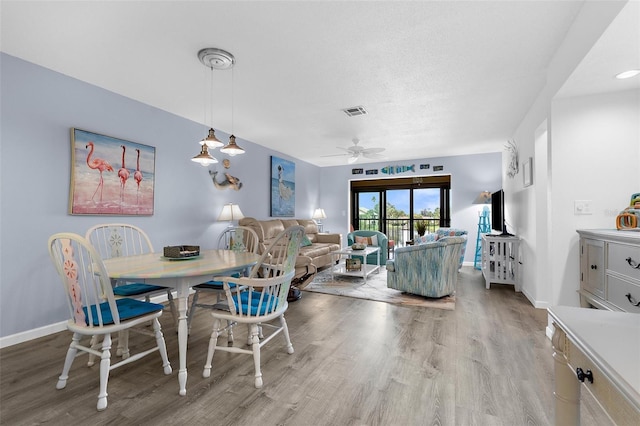 340 Three Lakes Ln Unit F, Venice, FL 34285 - dining room featuring wood finished floors and a ceiling fan