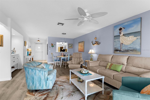 340 Three Lakes Ln Unit F, Venice, FL 34285 - living room with wood finished floors and ceiling fan