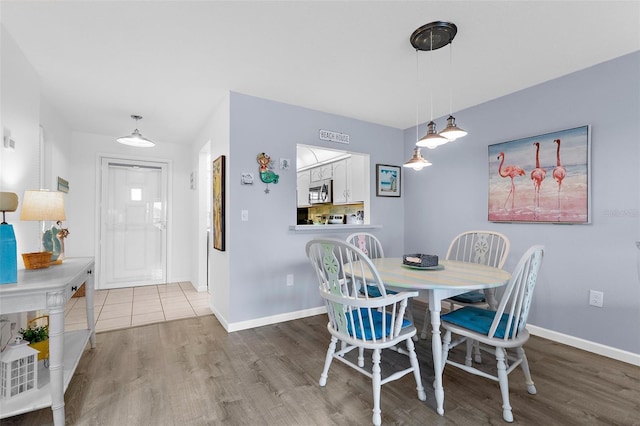 340 Three Lakes Ln Unit F, Venice, FL 34285 - dining room with wood finished floors