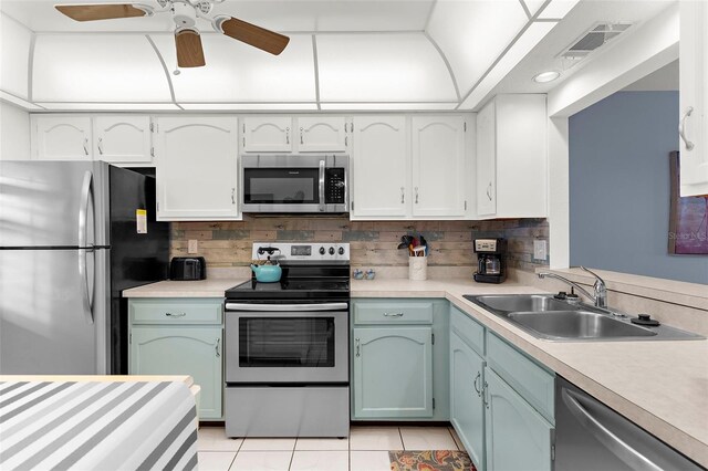 340 Three Lakes Ln Unit F, Venice, FL 34285 - kitchen with stainless steel appliances, light countertops, light tile patterned floors, ceiling fan, and tasteful backsplash