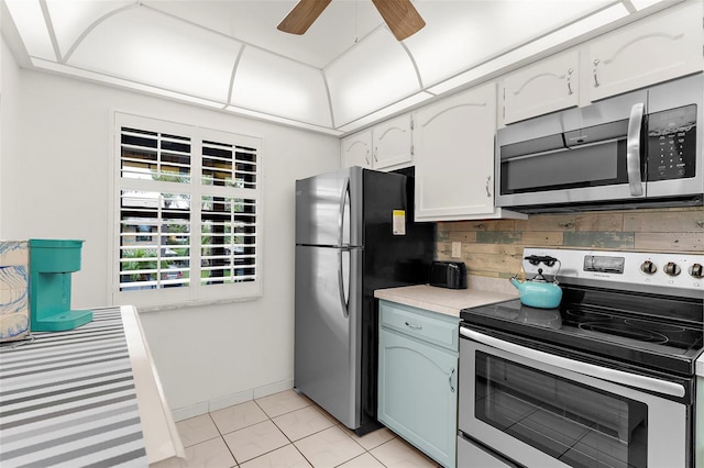 340 Three Lakes Ln Unit F, Venice, FL 34285 - kitchen featuring appliances with stainless steel finishes, light countertops, a ceiling fan, tasteful backsplash, and white cabinetry