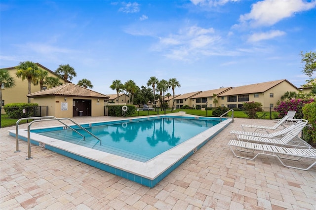 340 Three Lakes Ln Unit F, Venice, FL 34285 - community pool with a residential view and a patio