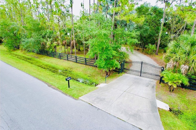 6522 Pimlico St, North Port, FL 34291 - view of concrete surface with a gate and a gated entry