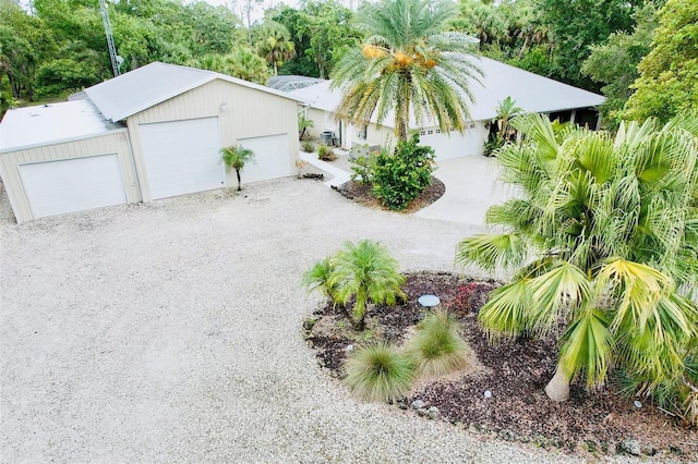 6522 Pimlico St, North Port, FL 34291 - view of front of house featuring a detached garage and an outbuilding