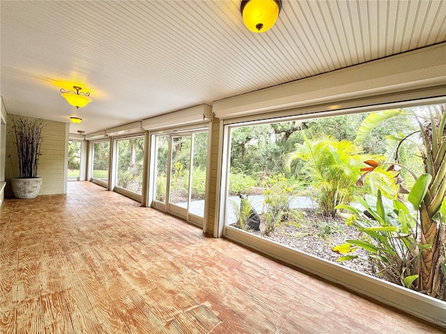 6522 Pimlico St, North Port, FL 34291 - unfurnished sunroom featuring plenty of natural light and wood finished floors