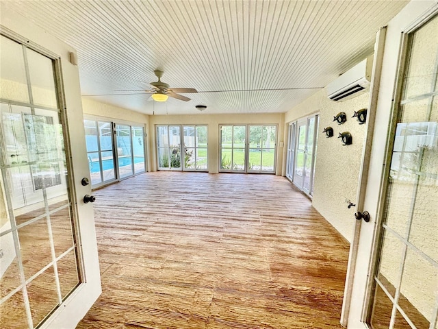 6522 Pimlico St, North Port, FL 34291 - unfurnished sunroom featuring a wall mounted AC, french doors, wood finished floors, and wooden ceiling