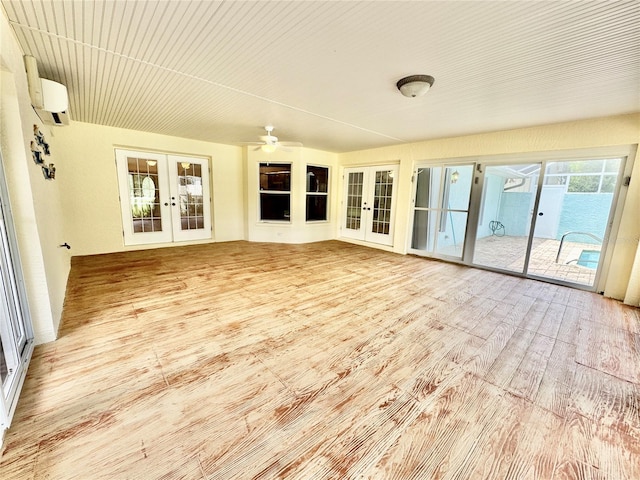 6522 Pimlico St, North Port, FL 34291 - unfurnished sunroom featuring french doors and a wall mounted air conditioner