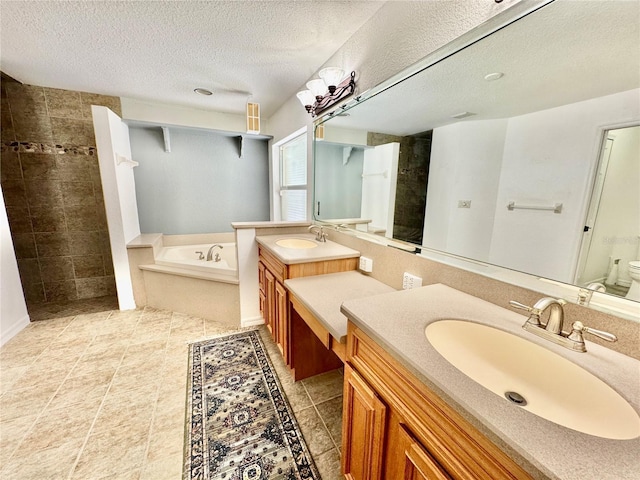 6522 Pimlico St, North Port, FL 34291 - full bathroom with vanity, a garden tub, a textured ceiling, and a tile shower
